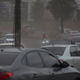 Drivers make their way through a light rain of volcanic ash, as Fuego erupts near Guatemala City.